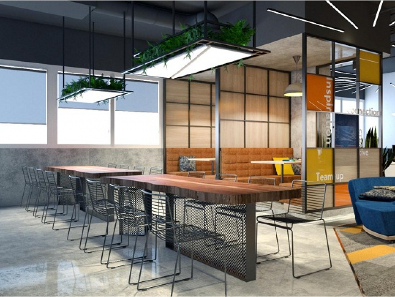 Minimalist meeting room at Comspace with long table and seating for team discussions.