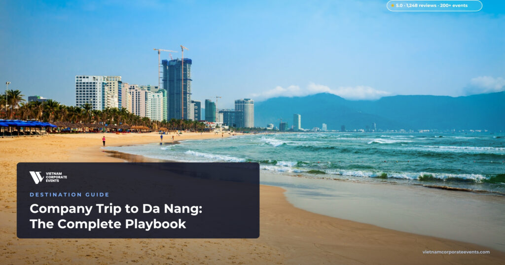 company trip to da nang corporate group on my khe beach with the city skyline behind