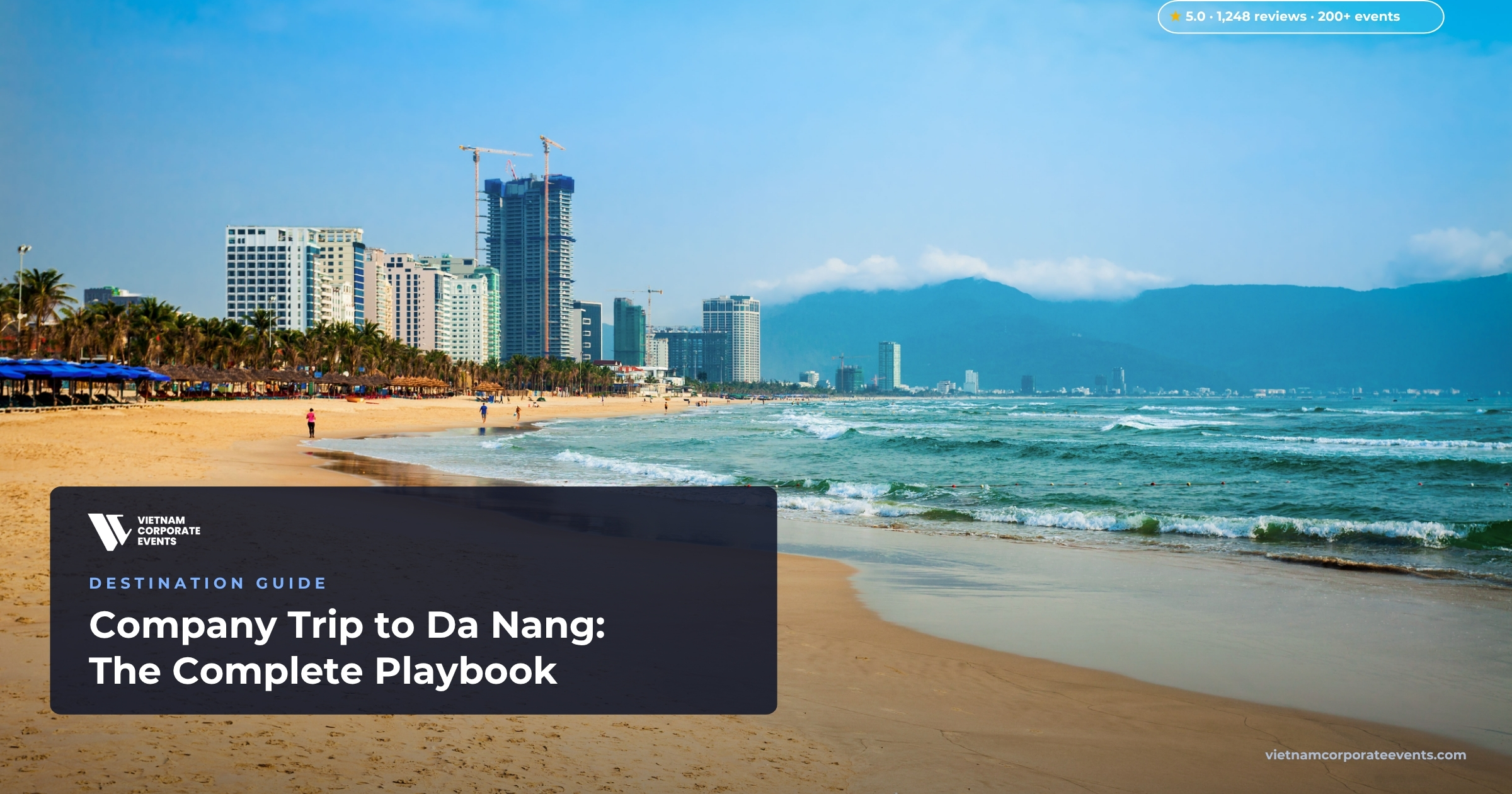 company trip to da nang corporate group on my khe beach with the city skyline behind