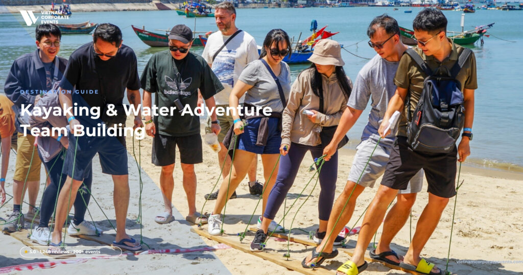 kayaking team building vietnam corporate pairs paddling in a sheltered bay